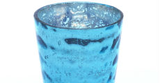 Turquoise votive candle close-up